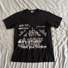 COMME des GARÇONS メッセージ ペイントスローガン Tシャツ - メルカリ