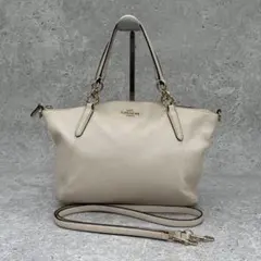 美品】COACH レザー 2WAY ハンドバッグ リボン 白 ストラップ付 - メルカリ