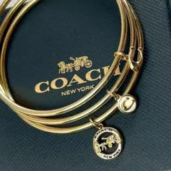 COACH コーチ 3連 ブレスレット バングル ゴールド チャーム 未使用級のサムネイル