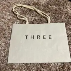 THREE ショッパー 約21cm x 15cm 紙製