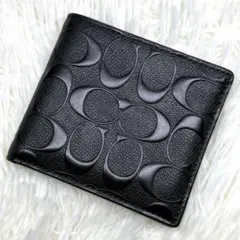 COACH 二つ折り財布 シグネチャー エンボス ブラック - メルカリ