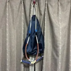 CRANK ダブルリボンタイドストリングバッグ ブラック ナップサック 
