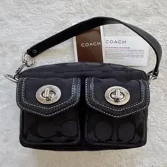 コーチ ハンドバッグ　アクセサリーポーチ　シグネチャー　ターンロック　キャンバス