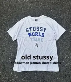 カウズとのコラボT OLD STUSSY ホワイト Tシャツ イエロー ロゴ - メルカリ