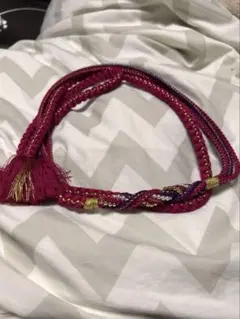 ピンクの編み込み帯締め（タッセル付き）