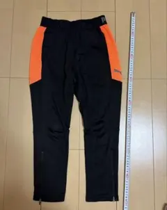 PUMA 黒/オレンジ ロングパンツ