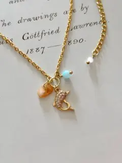 No.442＊ジルコニアイルカチャームとアクアマリンシェルの18kgpネックレス