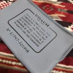 COACH 青 レザーポーチ ストーリーパッチ付き