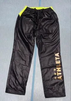 ATHLETA 150cmピステパンツ 黒/黄 シャカシャカ サッカー等