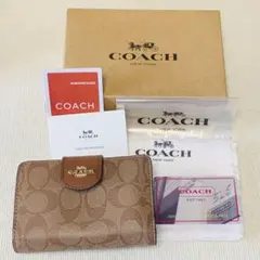 コーチ シグネチャー PVC レザー 二つ折りL字ファスナー財布 ブラウン系