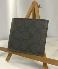 【新品未使用】コーチ　二つ折り財布　シグネチャー柄　ブラウン