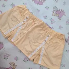 オレンジ色 ハーフパンツ ボタン付き