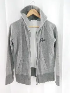 LACOSTE ラインストーンロゴ 裏起毛パーカー グレー系 サイズ36のサムネイル