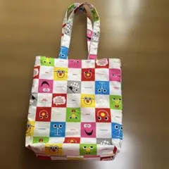 カラフルな顔のトートバッグ