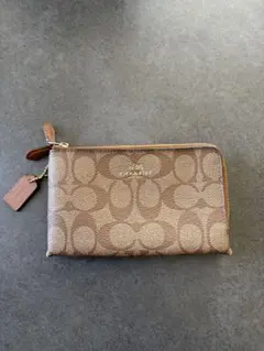 COACH ベージュ ポーチ　F64131