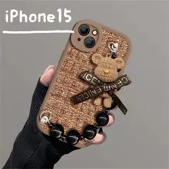 【iPhone15ケース】ツイード クママスコット ハンドストラップ付 ブラウン