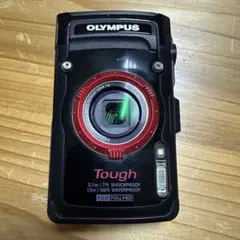 Final price reduction! OLYMPUS Tough digital camera with mini tripod.