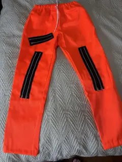 オレンジ カジュアルパンツ 黒ジッパー
