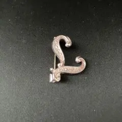 シルバー ストーン付き カールデザイン ブローチ