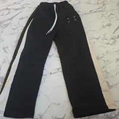 黒とベージュのストライプ長ズボン 140