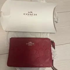 COACH レッド エンボスポーチ