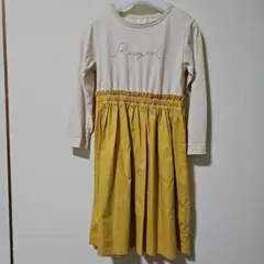ロゴ刺繍入りベージュ・イエローのワンピース 未着用