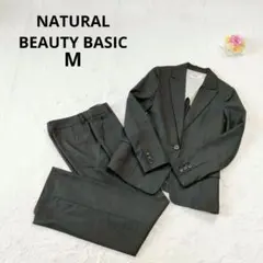 ナチュラルビューティーベーシック ウールシルク混セットスーツ ストライプ M 黒