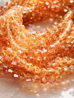 【5連】多面 ソロバンカット ガラスビーズ 琥珀色 オーロラ加工 約4ミリ