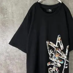 STUSSY 半袖 Tシャツ 縦ロゴ 総柄プリント ストックロゴ ブラック M