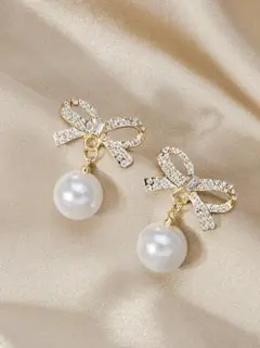 高見え リボン×パール ピアス ゴールド 揺れる 上品 韓国 大人可愛い 結婚式