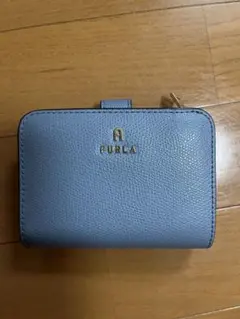 FURLA 二つ折り財布 ライトブルー チャーム付き FURLA 二つ折り財布 ライトブルー チャーム付き - メルカリ