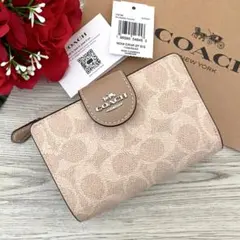 《新品未使用》COACH コーチ　ベージュ　シグネチャー レザー 二つ折り財布