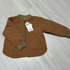 ブラウン中綿ジャケット OPPORTUNITYプリント