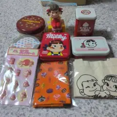 ペコちゃん貯金箱、ペコちゃん缶5点、シール、バンダナ、ミニトート