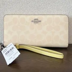 COACH 長財布　ベージュ　ストラップ付　シグネチャー　ラウンドファスナー