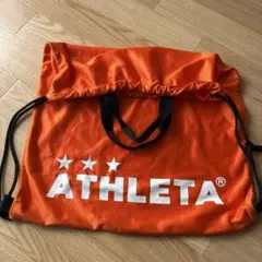 ATHLETA オレンジ ドローストリングバッグ