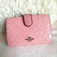 値下げ☆ COACH コーチ　二つ折り財布　エナメル　シグネチャー　ピンク