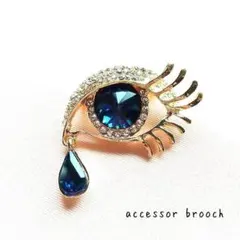 瞳 モチーフ ブローチ ラインストーン 付けまつげ ゴールド エレガント 個性派