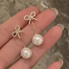 リボン パール ピアス 揺れる 上品 大人可愛い 韓国 シルバー 結婚式 仕事