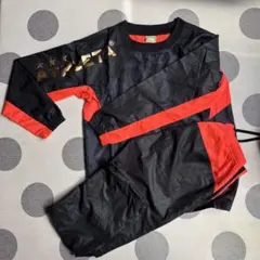 ATHLETA ピステ上下 黒/オレンジ　サイズ160