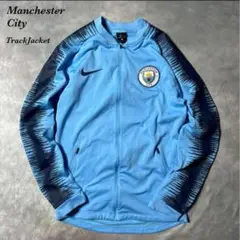 J58古着18年製NIKE水色トラックジャケットManchestercity