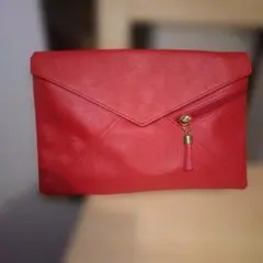 レッドタッセル付きクラッチバッグ中古品