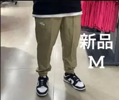 新品　NIKE ウーブンパンツ　Mサイズ　ベージュ　ジョガーパンツ
