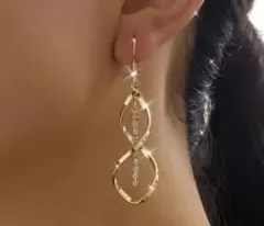 ゴールドクリスタル無限大イヤリング