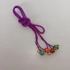 紫色の和装小物?/3つの飾り付き