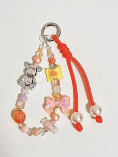 クマ・リボン・キャンディビーズチャームキーホルダー　オレンジ系　パラコード