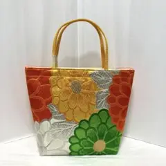 帯リメイク　バッグ　オレンジ緑黄銀糸の丸い菊