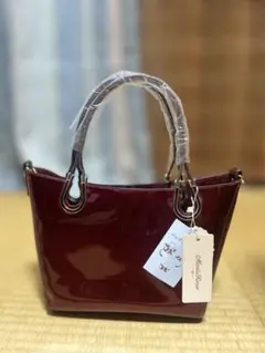MonteRosso ハンドバッグ ワインレッド エナメル調