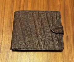 Brown leather bifold wallet with embossed design for men