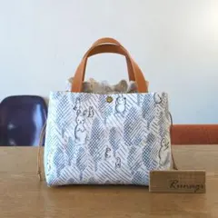 あおりポケットの巾着バッグ＊ミナペルホネン